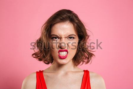 Close up portrait of a shocked pretty girl Stock photo © deandrobot