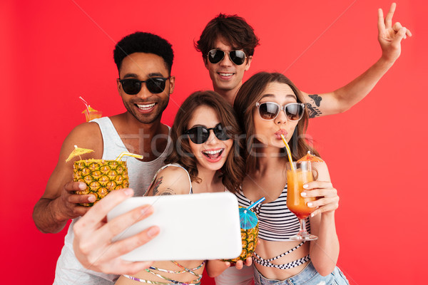 Group of happy young multiracial friends Stock photo © deandrobot