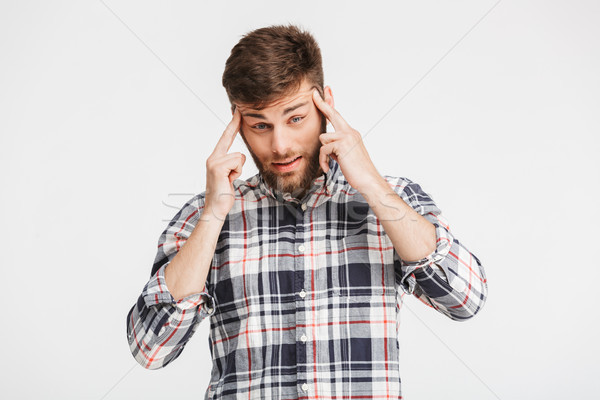 Stock photo: Portrait of a depressed young man in plaid shirt