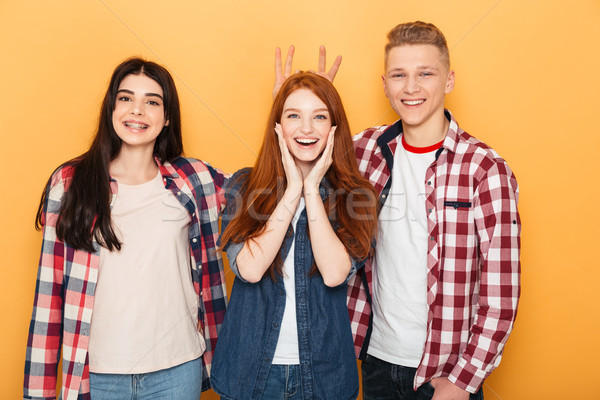 Group of happy school friends having fun together Stock photo © deandrobot