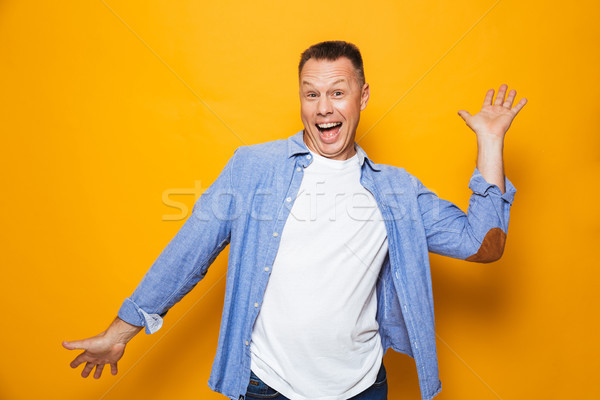 Portré boldog középkorú férfi ünnepel siker izolált Stock fotó © deandrobot