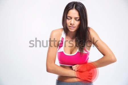 Portret kobieta fitness żołądka ból szary ciało Zdjęcia stock © deandrobot