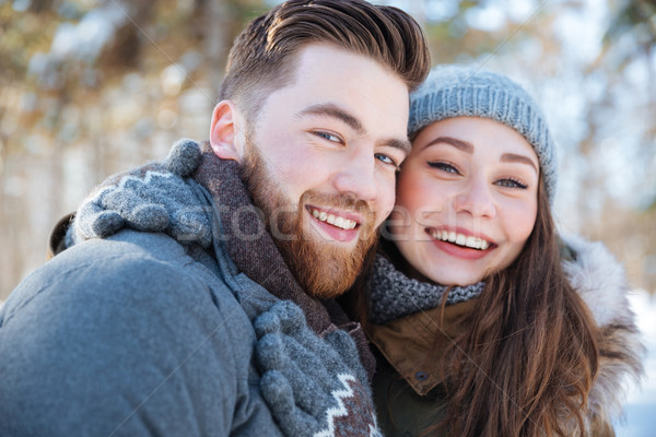 Stock photo: Smiling couple standing in winter park