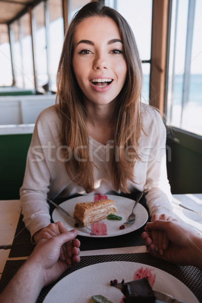 Verical image of woman on date in cafe Stock photo © deandrobot