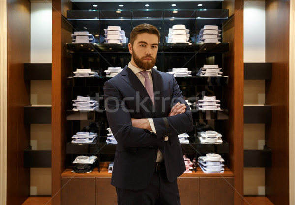 Man standing near the showcase Stock photo © deandrobot