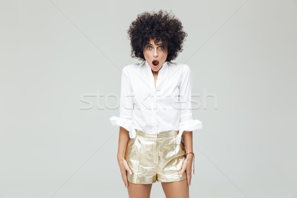 Shocked retro woman dressed in shirt Stock photo © deandrobot