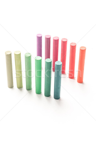 Bunch of standing colorful pastel chalks with color gradation Stock photo © deandrobot