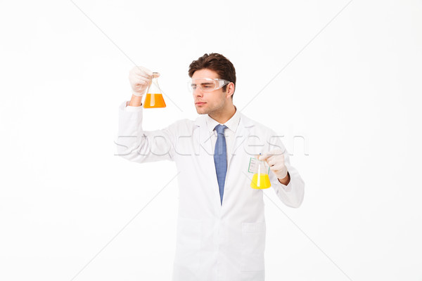 Portrait of a concentrated young male scientist Stock photo © deandrobot