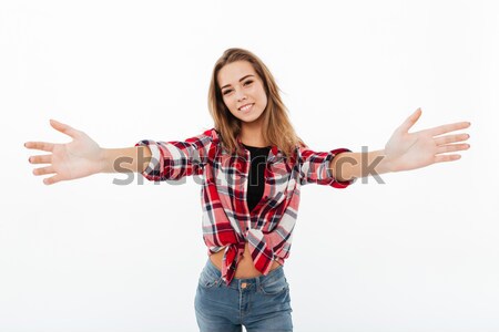 Portrait of a friendly smiling girl in plaid shirt Stock photo © deandrobot