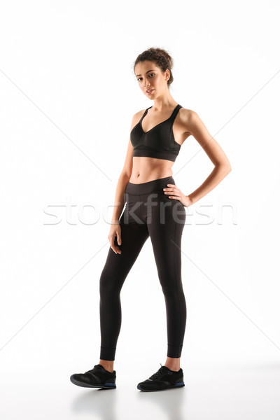 Kép mosolyog fitnessz nő tart kar csípő Stock fotó © deandrobot
