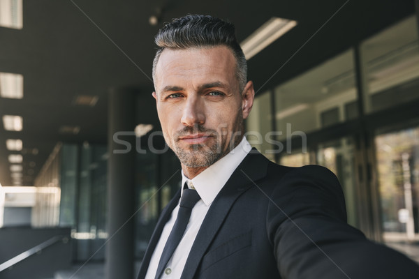 Portrait of a successful young businessman Stock photo © deandrobot