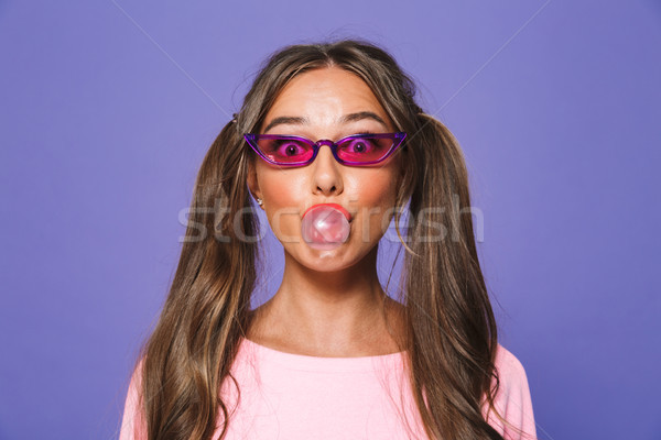 Portrait of a pretty girl in sweatshirt in sunglasses Stock photo © deandrobot