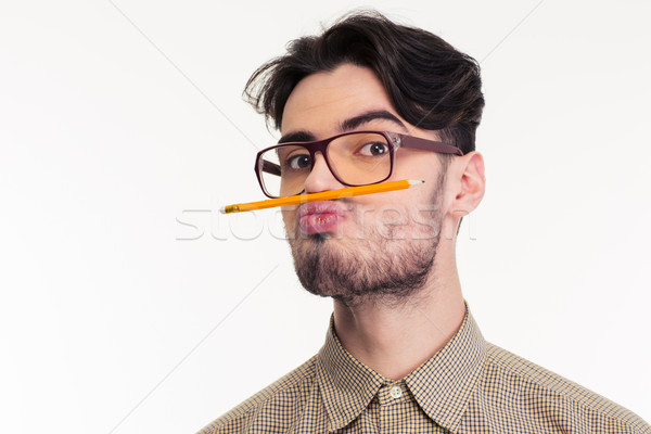 Man holding pencil between the lip and nose Stock photo © deandrobot