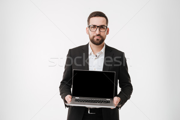 Geschäftsmann Display Laptop-Computer Bild jungen Stock foto © deandrobot