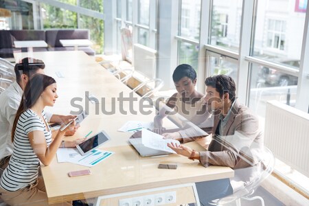 Cheerful young colleagues in office coworking make selfie Stock photo © deandrobot