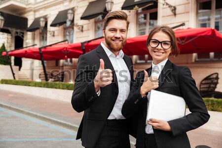 Portrait of a beautiful man and woman wearing smart clothes Stock photo © deandrobot