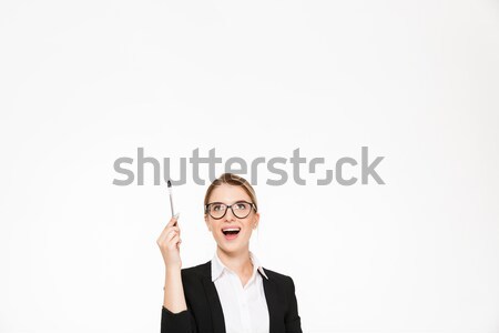 étonné heureux femme d'affaires lunettes pointant [[stock_photo]] © deandrobot