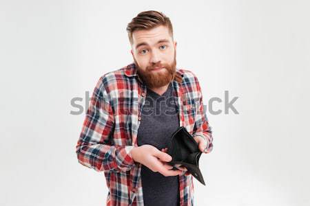Close-up portrait of playful young macho holding hes checkered s Stock photo © deandrobot