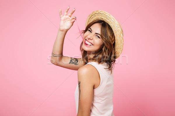 Portrait of a girl in summer hat looking at camera Stock photo © deandrobot