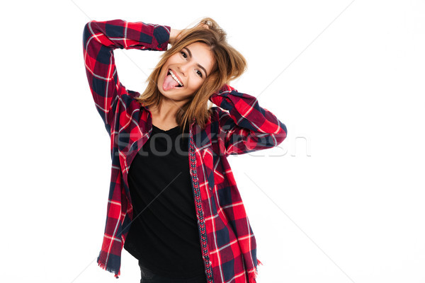 Funny young happy woman showing tongue. Stock photo © deandrobot
