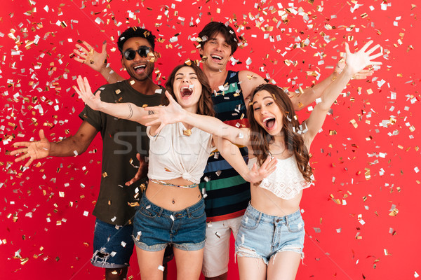 Portrait of a happy cheerful group of multiracial friends Stock photo © deandrobot