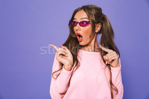 Portrait of a shocked girl in sweatshirt Stock photo © deandrobot