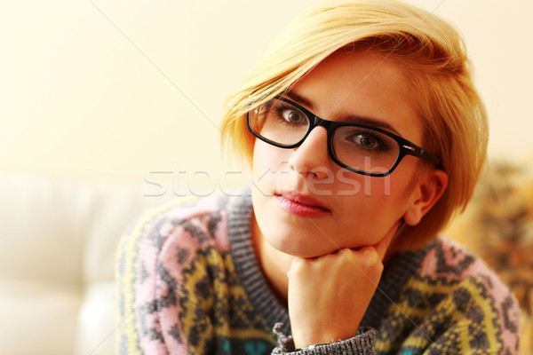 Stock photo: Closeup portrait of a young blonde woman in glasses