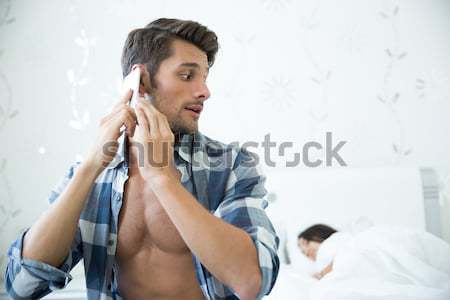 Człowiek mówić telefonu portret żona snem Zdjęcia stock © deandrobot