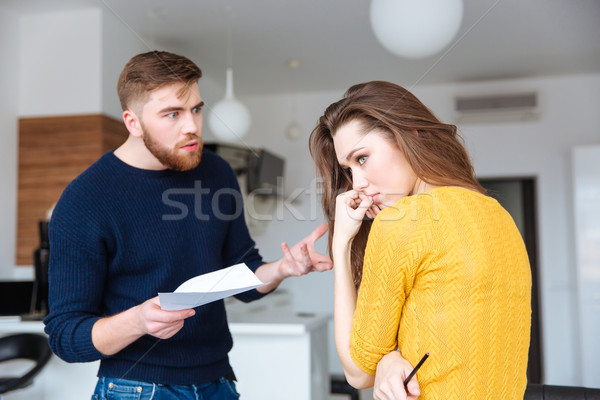 Couple discussing about domestic bills  Stock photo © deandrobot