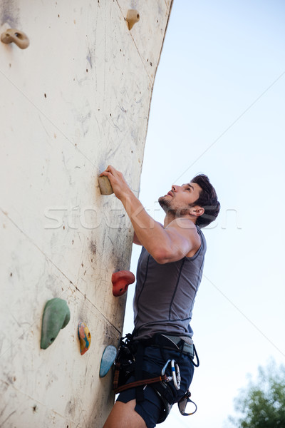 Junger Mann Ausübung Bergsteigen Übung Wand jungen Stock foto © deandrobot