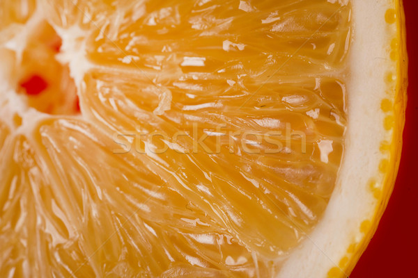 Cropped image of an orange slice Stock photo © deandrobot