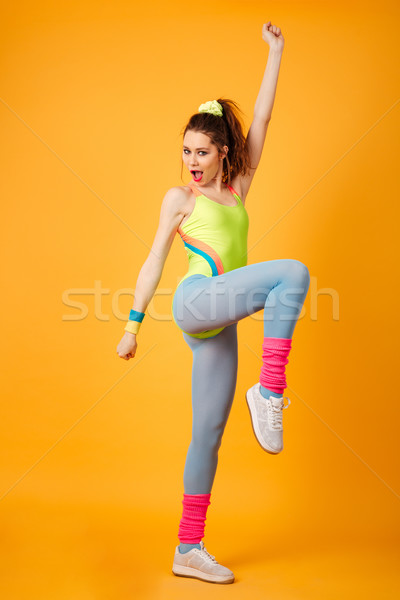 Boldog aktív fiatal fitnessz nő ugrik edz Stock fotó © deandrobot