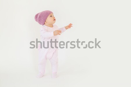 Little baby girl wearing hat sitting on floor Stock photo © deandrobot