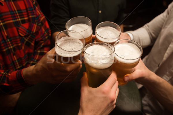 Close-up of men toasting with beer Stock photo © deandrobot