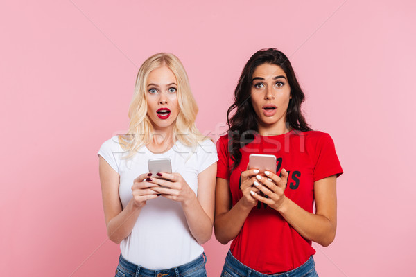 Kép kettő csinos megrémült nők tart Stock fotó © deandrobot
