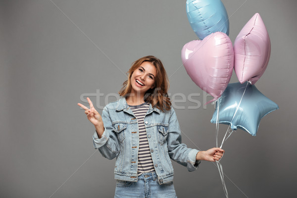 Excitado sonriendo jóvenes dama globos Foto stock © deandrobot