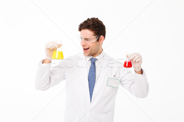 Portrait of a happy young male scientist Stock photo © deandrobot