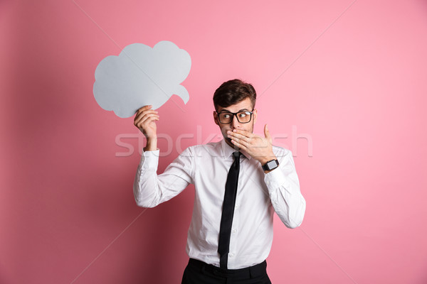 Portrait of a shy embarrassed man in white shirt Stock photo © deandrobot