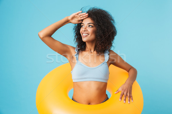 Portrait of a young african girl dressed in swimsuit Stock photo © deandrobot