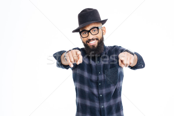 Stock photo: Smiling bearded young african american man pointing in camera 