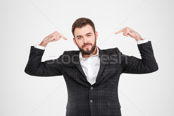 Proud businessman pointing fingers at herself Stock photo © deandrobot