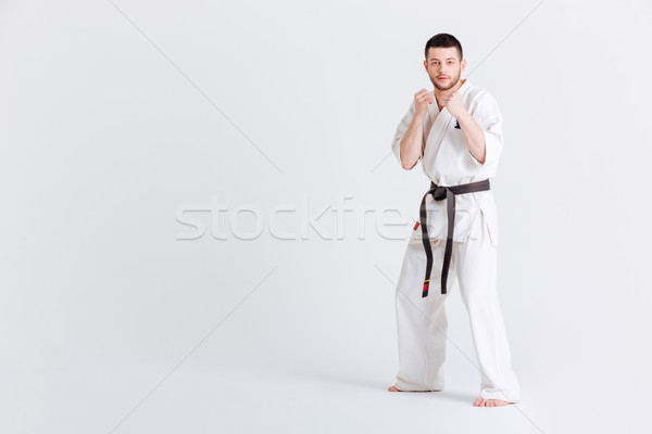 Man standing in fight stance Stock photo © deandrobot