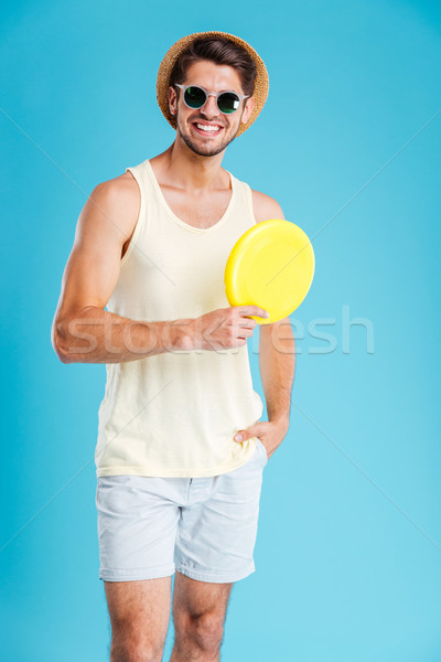Stockfoto: Gelukkig · jonge · man · hoed · zonnebril · frisbee