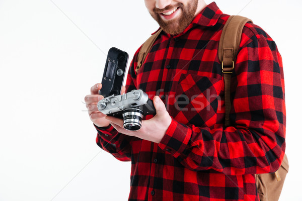 Cropped image of a man holding retro camera Stock photo © deandrobot