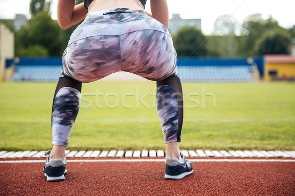 Vista posterior mujer atleta polainas aire libre deporte Foto stock © deandrobot