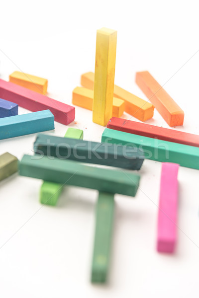 Cropped photo of  colored pastel chalks in a chaotic manner Stock photo © deandrobot