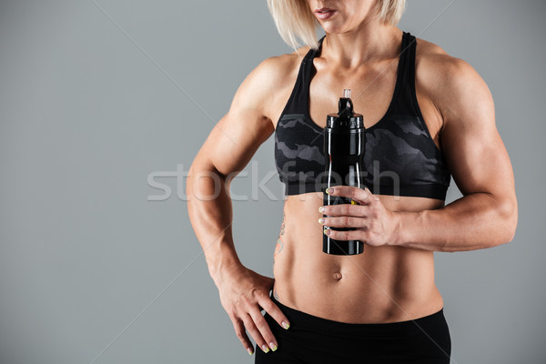 Cropped image of a muscular adult woman Stock photo © deandrobot