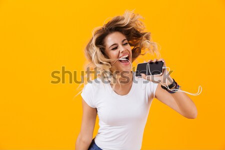 Emotional happy young pretty woman photographer Stock photo © deandrobot