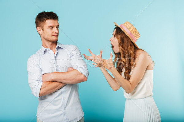 Angry caucasian loving couple friends quarrel. Stock photo © deandrobot