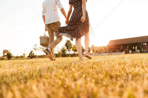 Cropped image of young couple with basket Stock photo © deandrobot